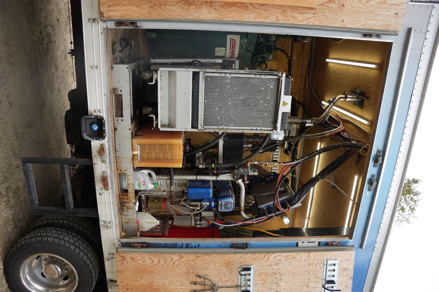 Spray foam proportioner and hose reels inside the truck